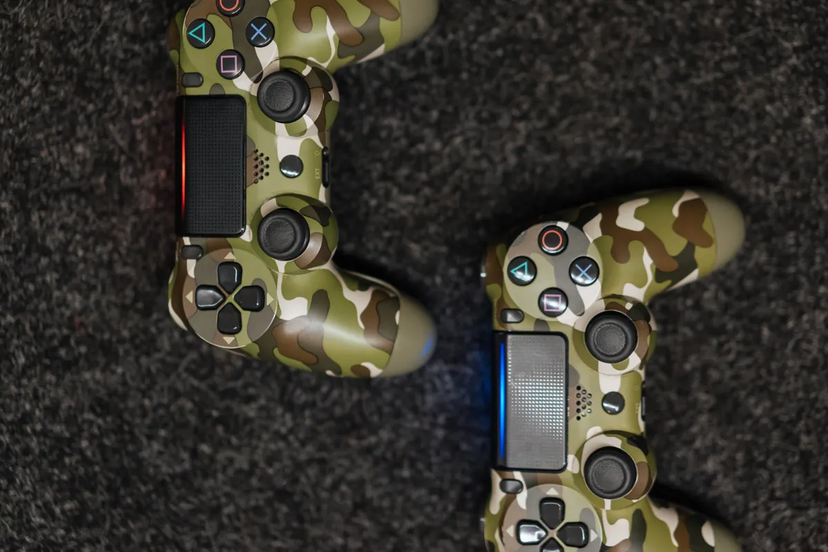 A game console controller resting on a dark surface